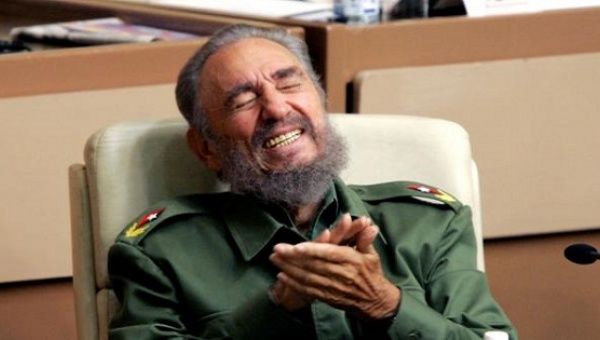 Cuban revolutionary leader Fidel Castro laughs during the year-end session of the Cuban parliament.