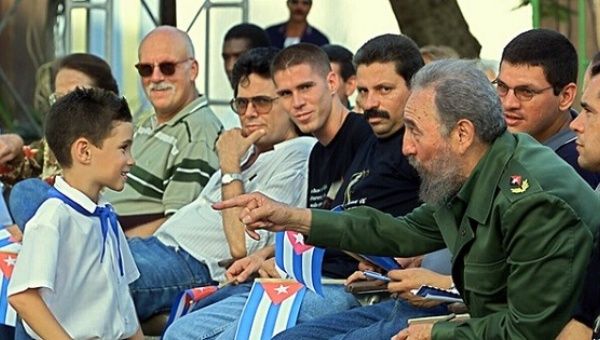 Cuban President Fidel Castro talks with Elian Gonzalez, July 14, 2001, in Cardenas, Cuba.