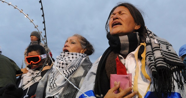 Women hold a prayer ceremony during a protest against plans to pass the Dakota Access pipeline near the Standing Rock Reservation.