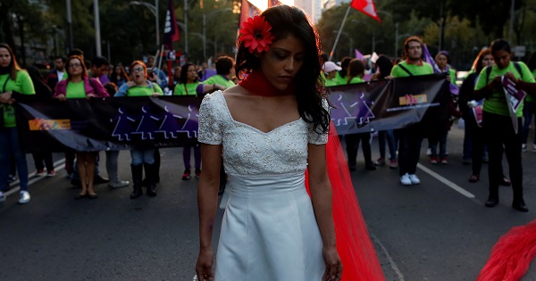 A woman takes part in a demonstration to commemorate the U.N. International Day for the Elimination of Violence against Women in Mexico City, Nov. 25, 2016.
