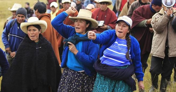 Community members protest against Newmont Mining's Conga gold project near the Cortada lagoon in Peru's Cajamarca region.