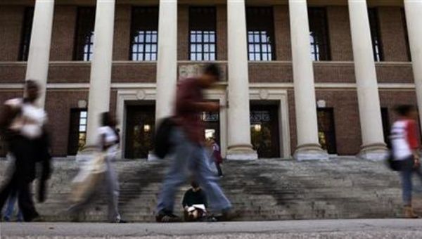 A students sits on the steps of Widener Library at Harvard University in Cambridge, Massachusetts September 21, 2009. 