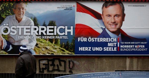 Presidential election campaign posters feature far right Freedom Party's Norbert Hofer and independent Alexander Van der Bellenin, Vienna, Austria, Dec. 1, 2016.