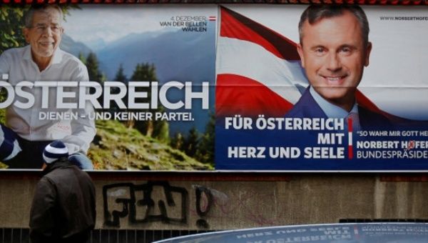Presidential election campaign posters feature far right Freedom Party's Norbert Hofer and independent Alexander Van der Bellenin, Vienna, Austria, Dec. 1, 2016. 
