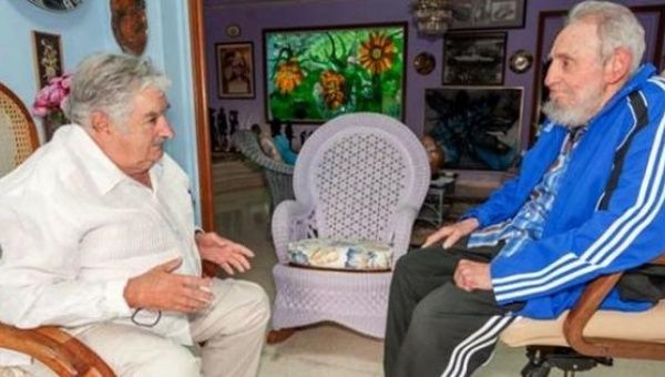 Former Uruguayan President Jose Mujica meets with former Cuban President Fidel Castro in Cuba in 2014.