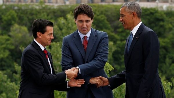 Mexico’s president, Enrique Peña Nieto, Canada’s prime minister, Justin Trudeau, and President Barack Obama of the US shake hands in Ottawa, Ontario, on 29 June 2016.