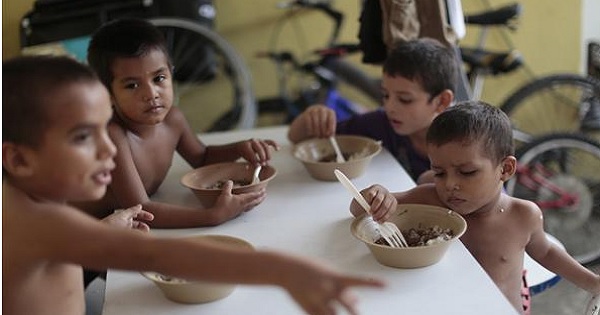 Central American children have meals at the Todo por ellos (All for them) immigrant shelter in Tapachula, Chiapas, in southern Mexico, June 26, 2014.