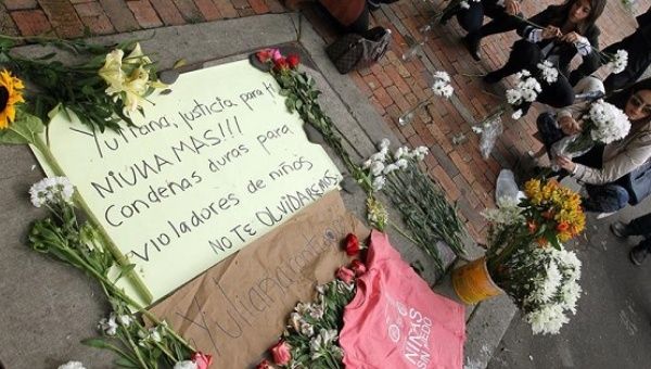 People protest the murder of Yuliana Andrea Samboni outside the apartment of suspect Rafael Uribe Noguera, in Bogota, Colombia, Dec. 5, 2016.