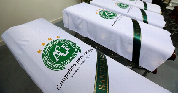 Blankets bearing the crest of Brazilian soccer team Chapecoense are placed on coffins after the deadly plane crash.