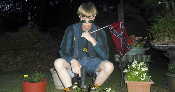 White supremacist Dylann Roof poses with the Confederate flag in a photo found after the Charleston Massacre.