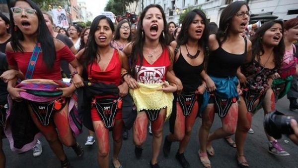 Women protest Keiko Fujimori in Lima with body paint representing the victims of forced sterilization under the Fujimori dictatorship.
