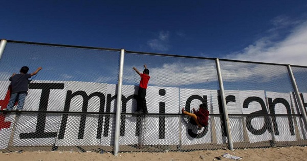 Children climb up the border fence between Ciudad Juarez and El Paso in the U.S. during a bi-national mass in support of migrants in Ciudad Juarez, Mexico.