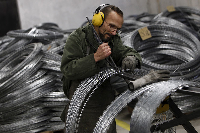 Hungarian prison inmates make razor wire which the country exports for use in border fences elsewhere.