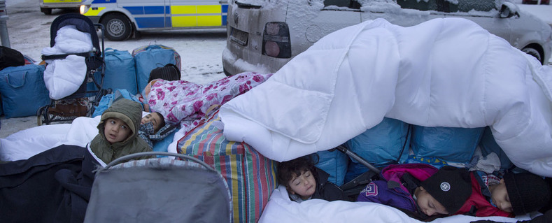 Refugees from Syria sleep outside the Swedish Migration Agency in Marsta a suburb of Stockholm Jan 28 2016.