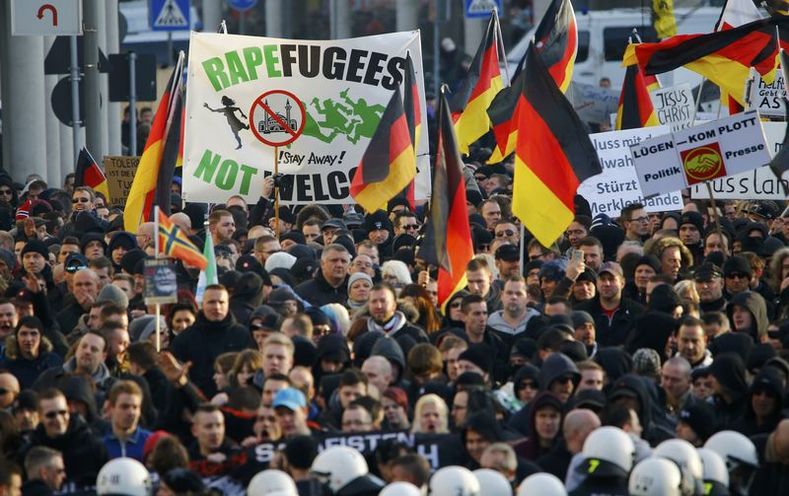 Supporters of anti-immigration right-wing movement PEGIDA protest in Cologne.