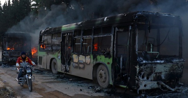 The buses were burned while en route to evacuate ill and injured people from the besieged Syrian villages of al-Foua and Kefraya, in Idlib province, Dec. 18, 2016.