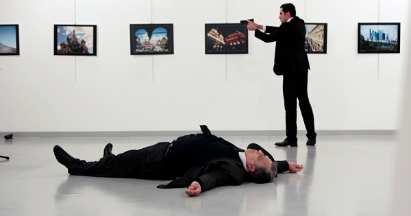 Russian Ambassador to Turkey Andrei Karlov lies on the ground after he was shot by unidentified man at an art gallery in Ankara, Turkey, Dec. 19, 2016.