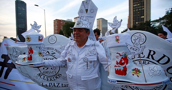 A supporter rallying for the nation’s new peace agreement with FARC attends a march in Bogota, Colombia, November 15, 2016.