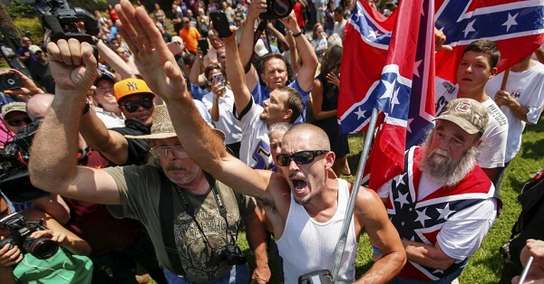 A supporter for the Ku Klux Klan and the Confederate flag yells at opposing demonstrators during a rally at the statehouse in Columbia, South Carolina July 18, 2015.