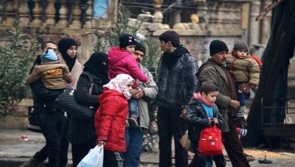 Families escaping bombing in Aleppo