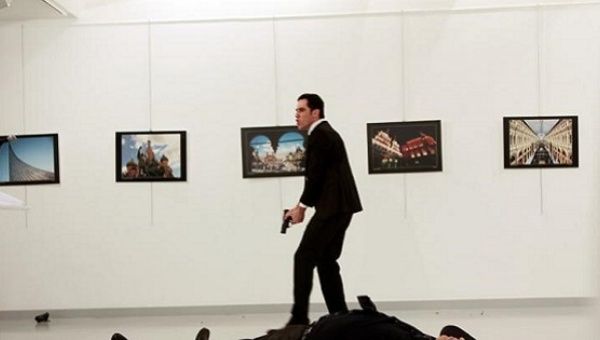 Russian Ambassador to Turkey Andrei Karlov lies on the ground after he was shot by Mevlut Mert Altintas at an art gallery in Ankara, Turkey, Dec. 19, 2016.