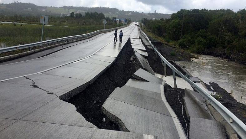 A damaged road is seen after a quake at Tarahuin, on Chiloe island, southern Chile, December 25, 2016
