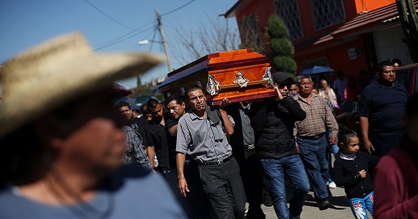Relatives and friends accompany the coffin of a victim of an explosion at a popular fireworks market on Mexico City's outskirts, in Tultepec, December 22, 2016.