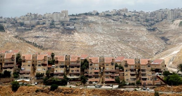 Houses are seen in the West Bank Jewish settlement of Maale Adumim as the Palestinian village of Al-Eizariya is seen in the background May 24, 2016.