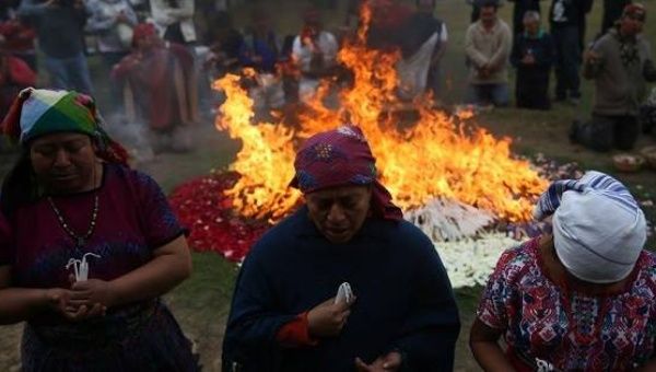 Guatemalan Indigenous people participate in a ceremony at the archaeological site Kaminal Juyú, to mark 20 years since the end of the civil war, Dec. 29, 2016.