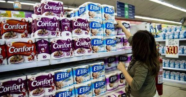 A woman shops for toilet paper produced by Chilean company CMPC at a supermarket in Santiago, Oct. 29, 2015.