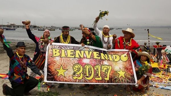 Peruvian shamans perform a ritual of predictions for the new year at Pescadores beach in Chorrillos, Lima, Peru, Dec. 29, 2016.