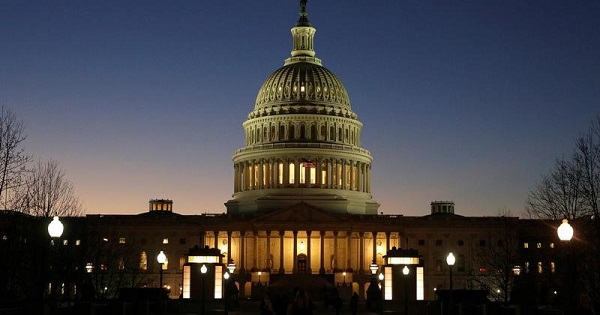 The U.S. Capitol Building is lit at sunset in Washington, U.S..