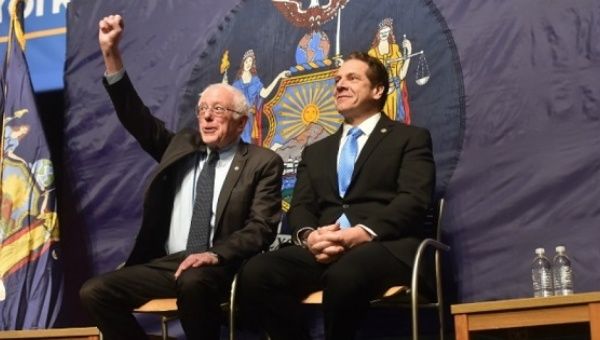 U.S. Senator Bernie Sanders and New York Gov. Andrew Cuomo announce a free tuition plan in Queens, New York, Jan. 3, 2017. 