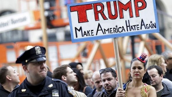 People take part in an anti-Donald Trump, pro-immigration protest. 