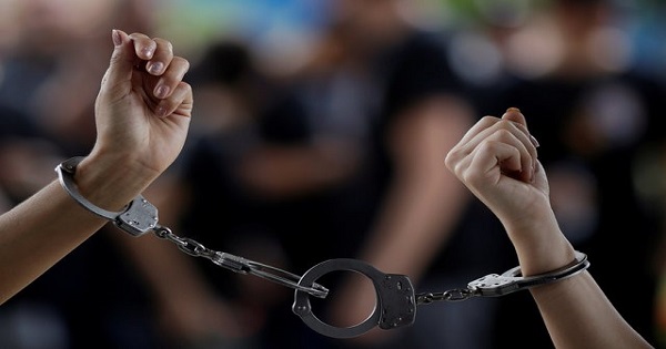 Forensic experts of the Civil Police are handcuffed during a protest against bad working conditions and low pay in front of the Court of Justice in Manaus, Brazil, January 5, 2017.