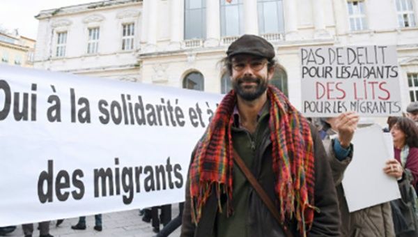 Cedric Herrou, with supporters, outside the courthouse in Nice, France. Jan. 4, 2016