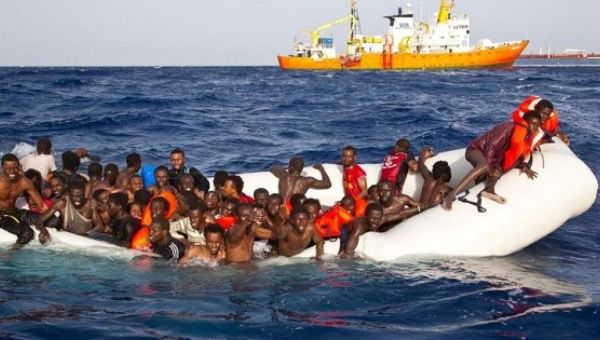 Migrants sit in a rubber dinghy during a rescue operation by SOS Mediterranee ship Aquarius off the coast of the Italian island of Lampedusa in this handout received April 18, 2016. 