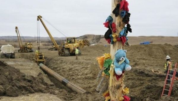 A log adorned with colorful decorations remains at a Dakota Access Pipeline protest encampment as construction work continues on the pipeline near the town of Cannon Ball, North Dakota.