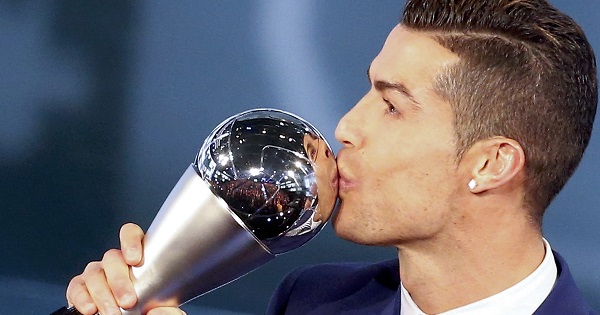 Cristiano Ronaldo celebrates with the trophy.