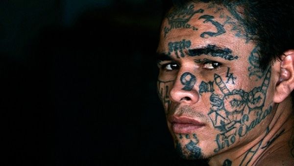 A former leader of the Mara Salvatrucha or M13 gang, poses during a photo session at Comayagua jail in Honduras in February 2008.