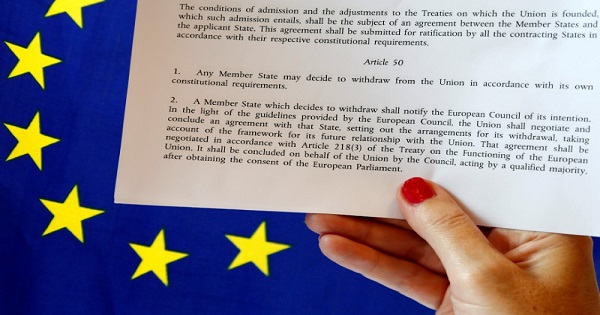 Article 50 of the EU's Lisbon Treaty that deals with the mechanism for departure is pictured near an EU flag following Britain's referendum results.