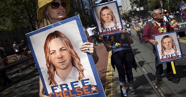 People hold signs calling for the release of imprisoned whistleblower Chelsea Manning in San Francisco, California June 28, 2015.