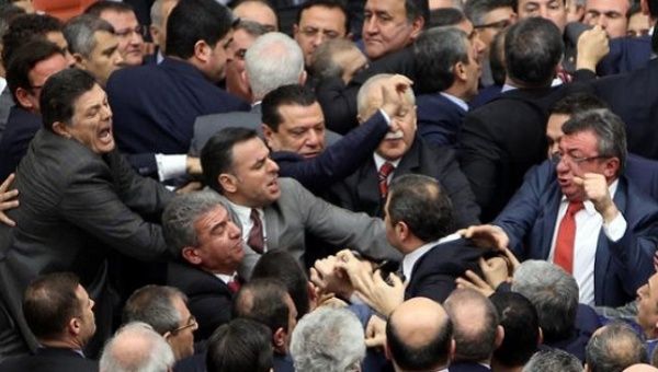 Lawmakers from ruling AK Party and the main opposition CHP scuffle during a debate on the proposed constitutional changes at the Turkish Parliament in Ankara.