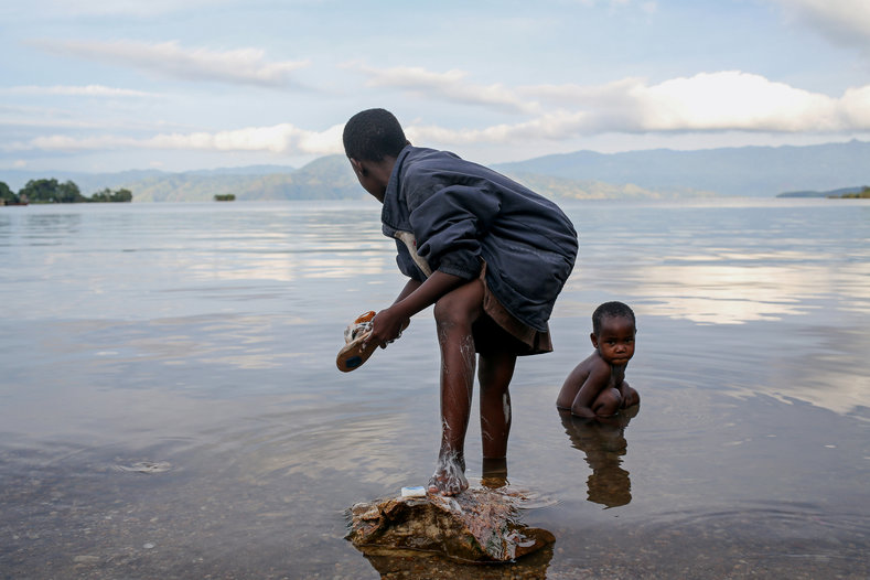 Bahavu children wash on the shore of Lake Kivu, on Idjwi island. Idjwi, in the middle of Lake Kivu, has been spared the ravages of wars in eastern Congo that have killed millions of people since 1996, mostly from hunger and disease.