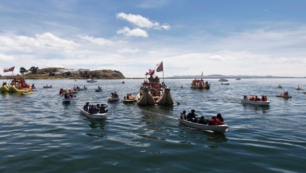 Actors sail in a totora raft during a re-enactment of the legend of Manco Capac and Mama Ocllo in an Uros island at Lake Titicaca in Puno. 