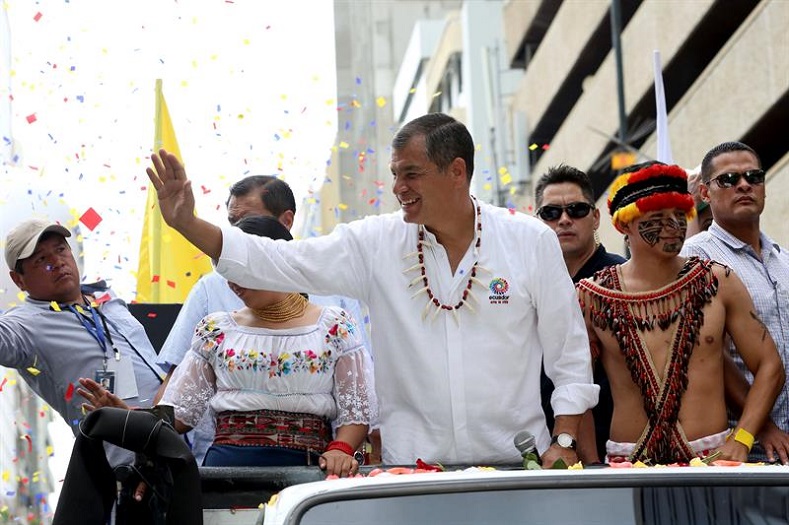 Rafael Correa waves at supporters in Guayaquil. 