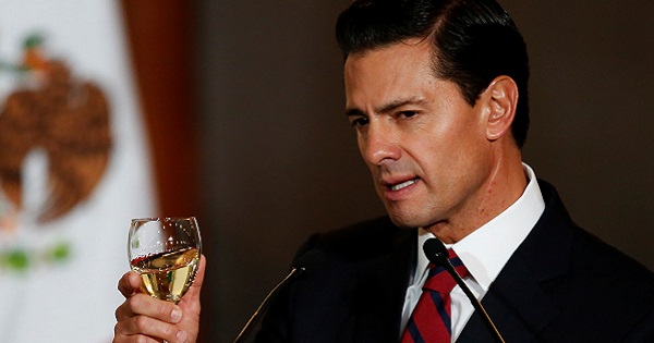 Mexico's President Enrique Pena Nieto makes a toast during a meeting with members of the diplomatic corps in Mexico City, Mexico Jan. 11, 2017.