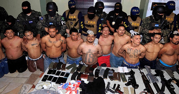 Suspected gang members are presented to the media after being detained during a police operation in search of the killer of journalist Igor Padilla, San Pedro Sula, Honduras, Jan. 18, 2017.
