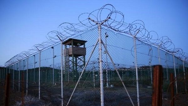 Chain link fence and wire surrounds a deserted guard tower in Joint Task Force Guantanamo's Camp Delta at the U.S. Naval Base in Guantanamo Bay, Cuba March 21, 2016. 