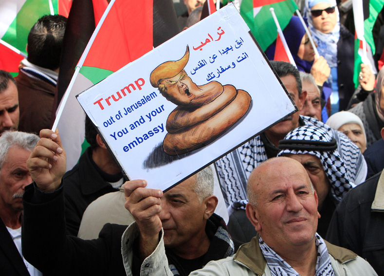 Palestinian demonstrators take part in a protest against a promise by U.S. President-elect Donald Trump to re-locate the U.S. embassy to Jerusalem, in the West Bank city of Nablus, Jan. 19, 2017.